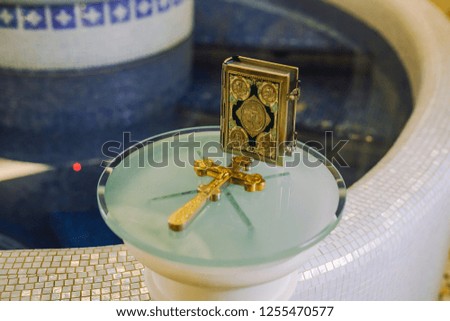 Bible and gold cross, wedding ceremony.