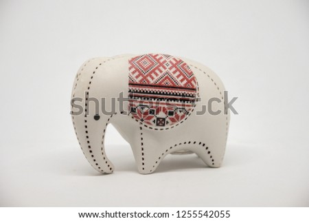 Small ceramic elephant  isolated on white background.