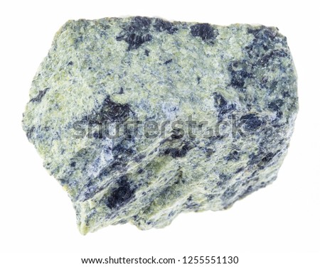 macro photography of natural mineral from geological collection - rough serpentinite stone on white background