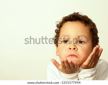 little boy blowing a kiss stock phone