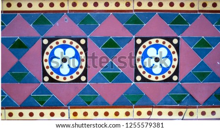 Geometric Coloured Tiles. Flower Design Tiles. Triangles. Circles. Tiled Wall. Coloured Tiles.