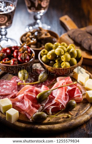 Serrano ham platter with variation of appetizers