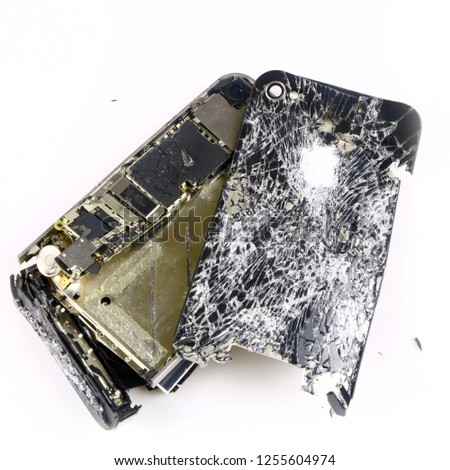shattered, broken smartphone on white background