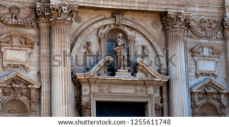 A stone baroque statue of St. Irene, patron saint of Lecce, adorns the exterior of the church of Santa Irene. The famous city is known as 'the Florence of the South'.

 Royalty-Free Stock Photo #1255611748