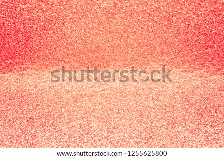  Bright living coral color defocused glitter texture background. 