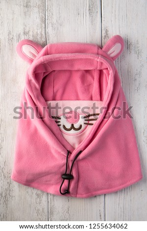 Children's hat in the form of a pink rabbit