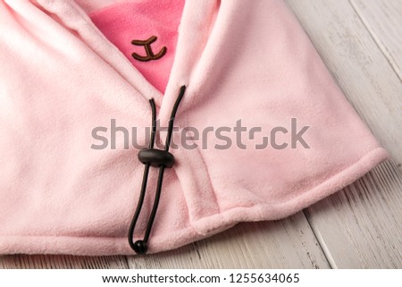 Children's hat in the form of a pink sheep