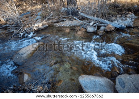 autumn winter scenic rocky creek or stream in Eastern Sierra Nevada mountains, California, USA