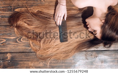 Perfect hair. Blonde brunette long hair. Perfect woman wood background. Beauty and perfect health hair. Beauty model with perfect clean skin and with good hair