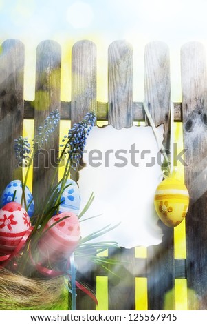 Art easter background with fence, eggs, spring flowers, blank card for design or greating card