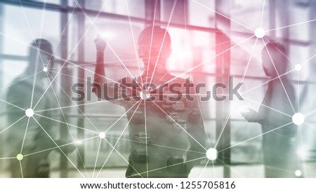 Blockchain network on blurred skyscrapers background. Financial technology and communication concept.