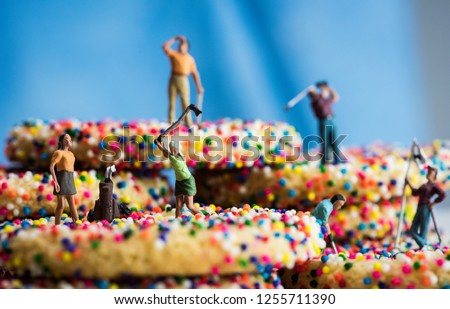 Miniature Figures Golfing on Sprinkle Cookies