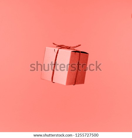 Seemless pattern of craft  cardboard gift boxes on the solid pink background. Holiday and gift concept. Pop art slyle. Square. Living coral theme - color of the year 2019