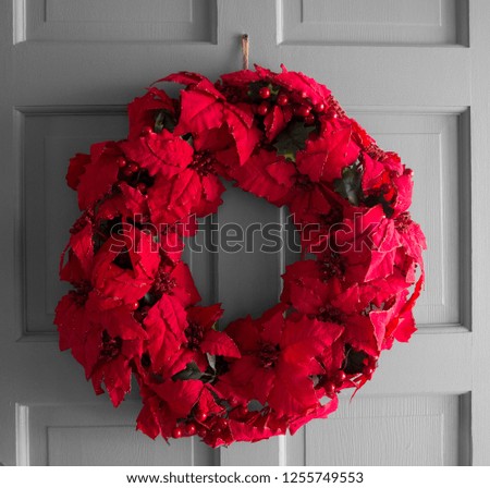 Poinsettia Wreath on a White Door