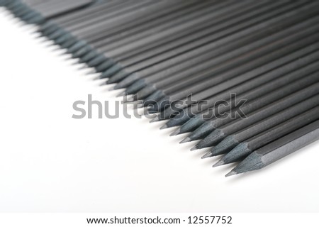 black pencils on white background