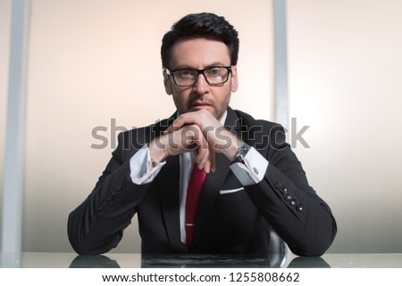 close up.serious businessman sitting at his Desk