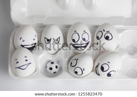 football team. eggs with funny faces. eggs and ball. photo for your design