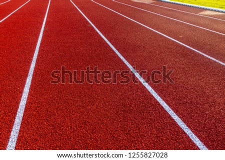 Red running track in stadium 