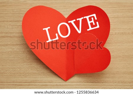 Valentine's day red paper heart on abstract wooden background with for text love and young happy joyful, paper cut red heart, love Invitation card
