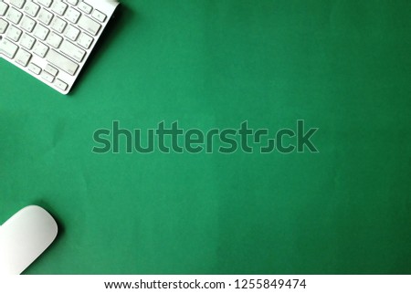 top view and copy space , flat lay office green desk with keyboard notebook phone