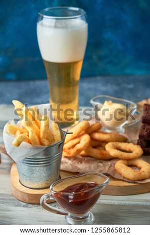 a variety of snacks for light beer in a glass pic