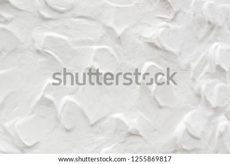 white cement pattern decorated on wall of home.