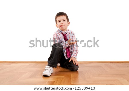 Little boy sitting and explaining something