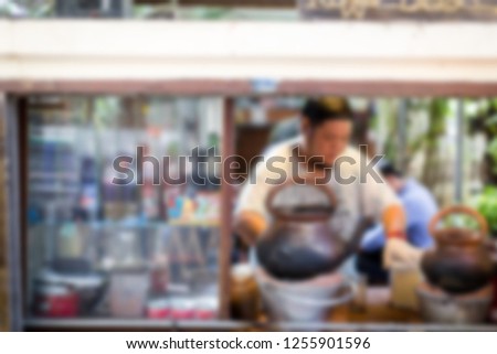 Man is making coffee, Picture of blurred for background abstract and can be illustration to article of coffee shop or beverage 