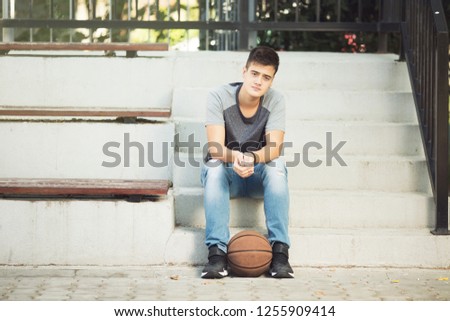 Beautifull teenage boy with basketball ball 