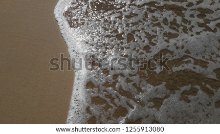 Soft wave of ocean on the sandy beach Sri Lanka
