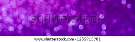 purple Sparkling Lights Festive background with texture. Abstract Christmas twinkled bright bokeh defocused and Falling stars. Winter Card or invitation.