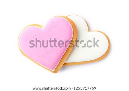 Decorated heart shaped cookies on white background