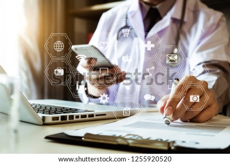 medical technology concept,smart doctor hand working with modern laptop computer in modern office with virtual icon diagram
