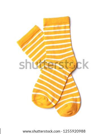 Pair of cute child socks on white background, top view Royalty-Free Stock Photo #1255920988