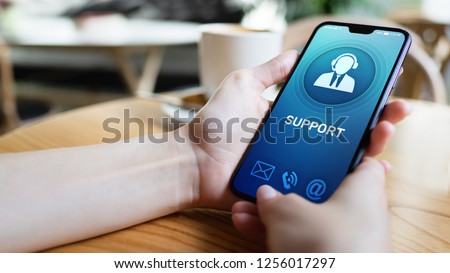 Support, Customer service icon on mobile phone screen. Call center, 24x7 assistance. Royalty-Free Stock Photo #1256017297