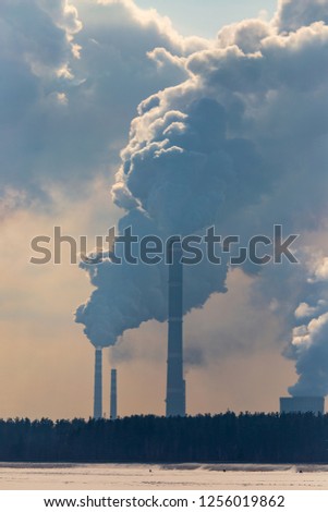 Smoke from pipes in a factory pollutes nature .