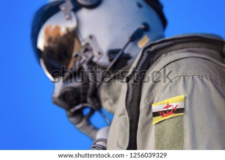 Air force pilot flight suit uniform with  Brunei flag patch. Military jet aircraft pilot