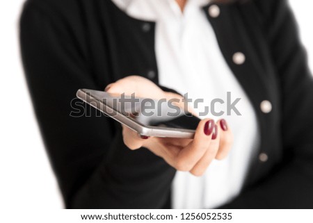 Phone in hand of a girl on a white background .