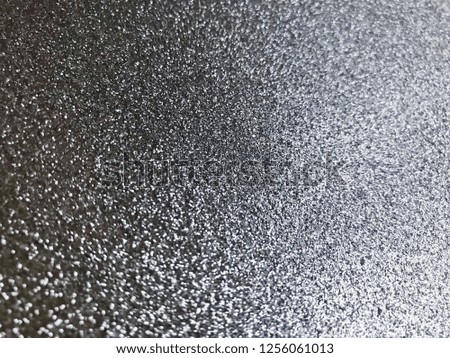 silver and white glitter texture christmas abstract background. Silver Sparkle Wallpaper for Christmas. Festive glitter background.Silver glitter background black bokeh abstract Christmas