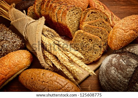 fresh bread  and wheat on the wooden Royalty-Free Stock Photo #125608775