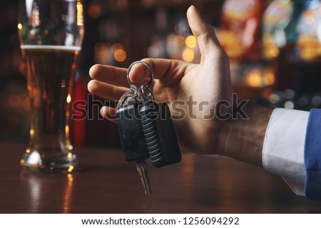 Do not drink and drive! Cropped image of drunk man talking car