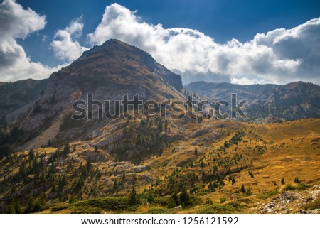 Stunning mountain scenery with clouds in autumn