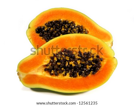 Papaya fruit sliced on half isolated on a white background.
