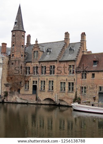  Europe, Belgium, West Flanders, Bruges wonderful old 
building on the Bank of the canal
                    