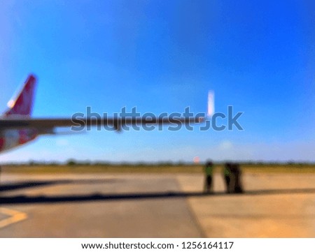 Blurred picture of the wing plane with blue sky background