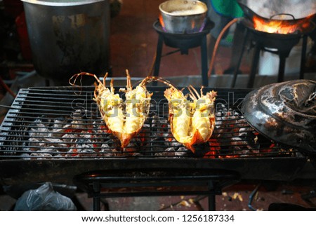 Lobsters sold by street vendor at China Town, Yaowarat, at night in Bangkok
