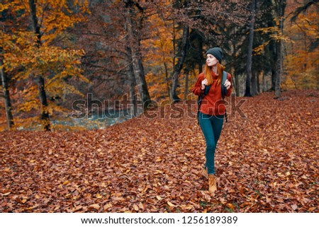 female tourist In the autumn forest              