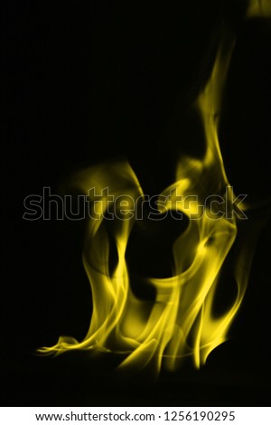 Yellow Fire flames isolated on black background.
