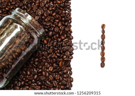 scattered coffee beans from glass bottle isolated on white background with number one word
