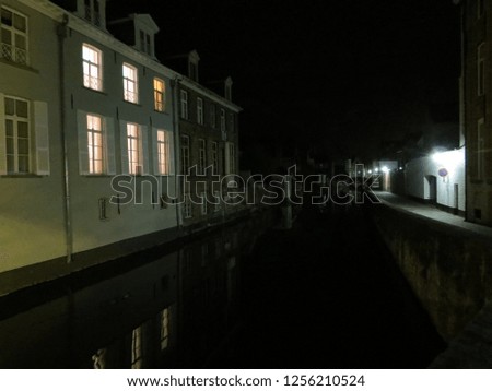Europe, Belgium, West Flanders, Bruges,Old houses by 
the canal at night
         
